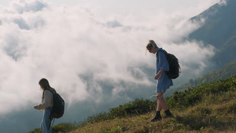 women hiking in misty mountains