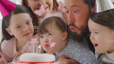 Family-With-Down-Syndrome-Daughter-Celebrating-Birthday-With-Party-At-Home-Together