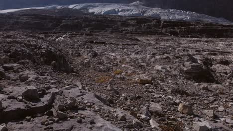 Glacier-flyover-rocks-in-mountains-approached