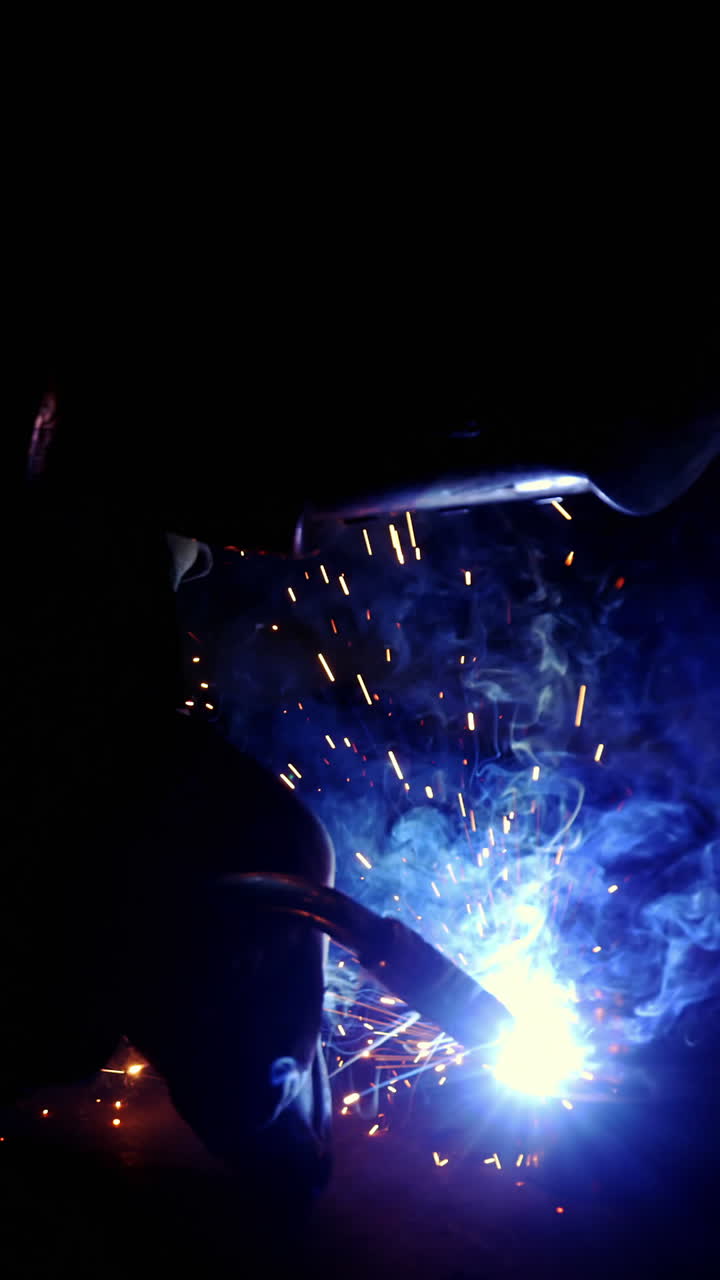 Welder working on a piece of metal