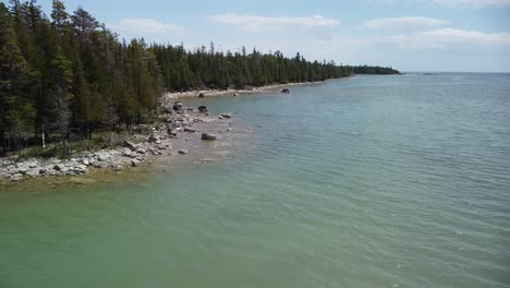 aerial lakeshore coastline ascent, bush bay scenic overlook, les cheneaux islands, michigan