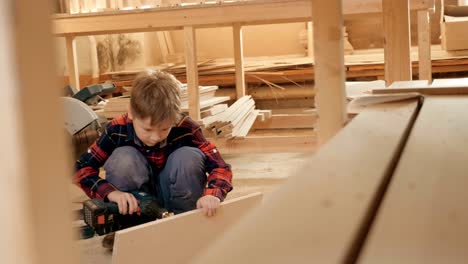 boy learning woodworking