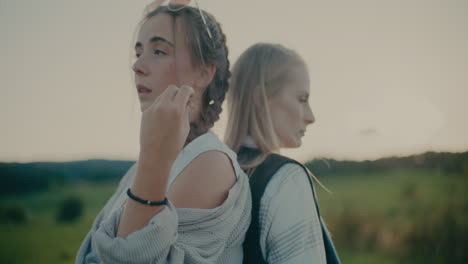 sad woman with female tourist friend at vacation