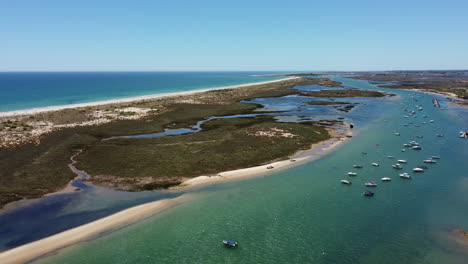 Aerial-View-Of-Beautiful-River-And-Coastline-In-Tavira,-Algarve,-Portugal-At-Summer