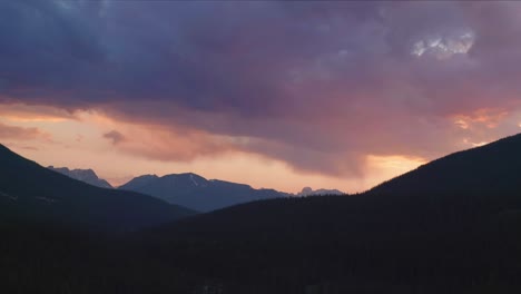 dramatic sunrise time lapse and cloudy sky over mountains in banff national park
