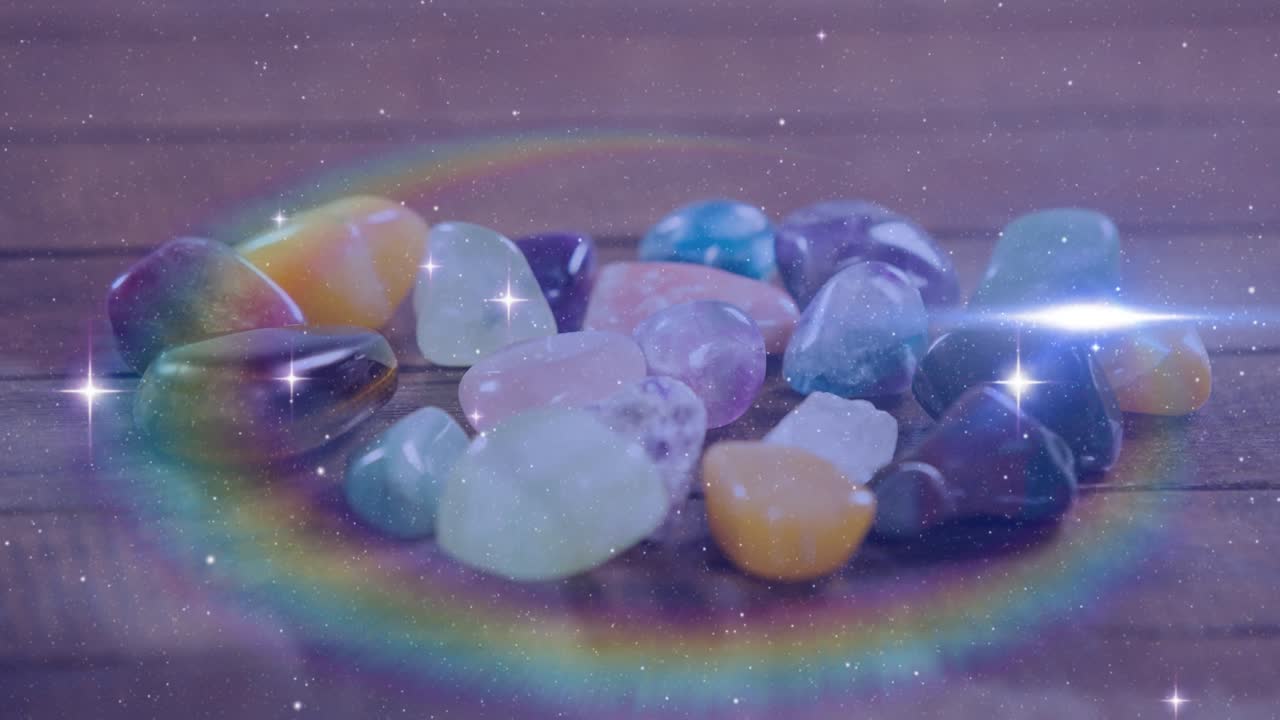 animación de estrellas y puntos de luz sobre piedras de colores