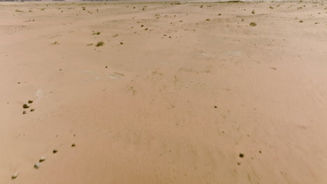 aerial shot of the barren desert in wadi rum, jordan