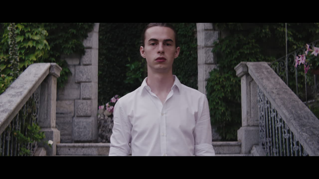 Man in White Shirt at Stone Stairway