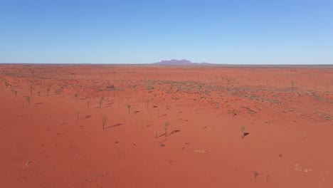 panorama of red desert with distant view of mount olgas - uluru-kata tjuta national park in northern territory, australia