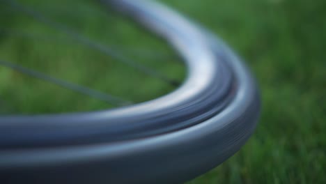 slowmo - close up of a bike wheel spinning with blurred background