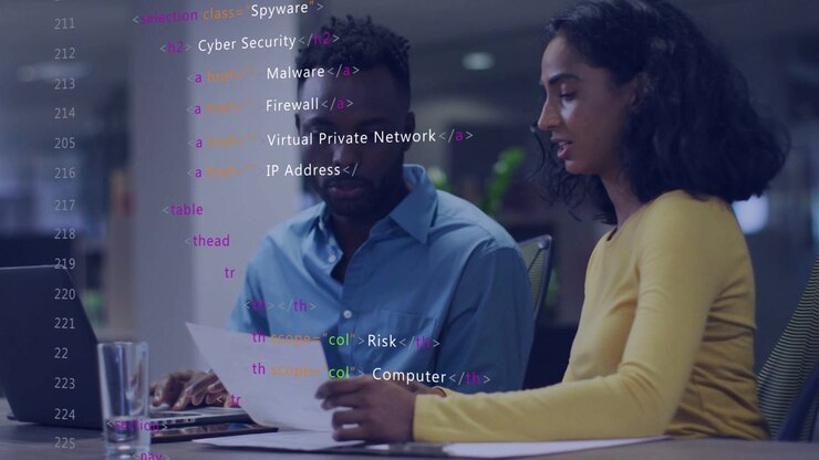 Woman pointing paper, guiding coworker reviewing security report, laptop, code overlay growing