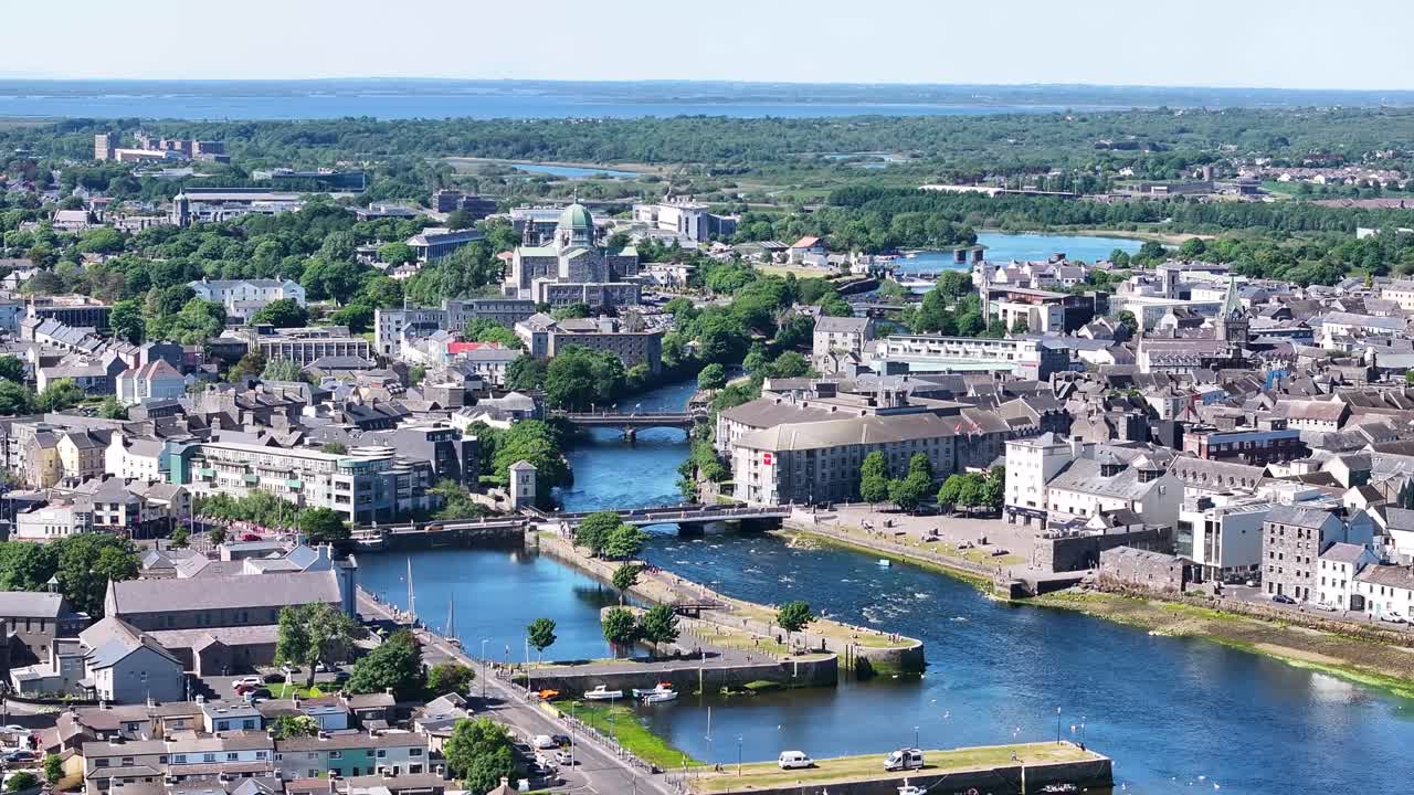 Beautiful view of Galway city historic old town and river. Sunny day in Ireland. Aerial