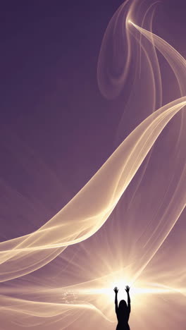 silhouette of a woman with uplifted hands in a sunrise/sunset setting