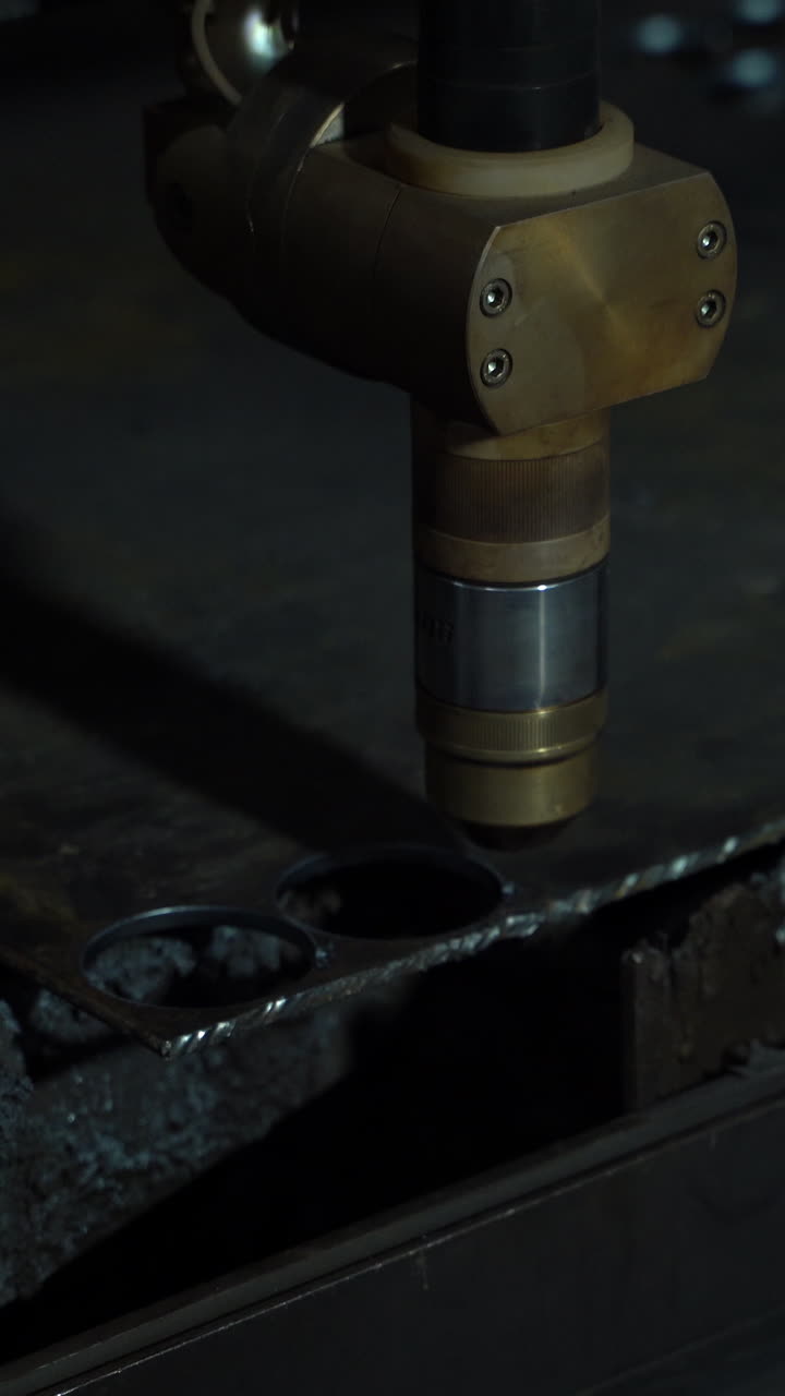 plasma cutter. Plasma robotic industrial equipment works with metal sheet. Vertical video
