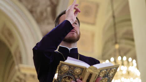 priest holding holy book