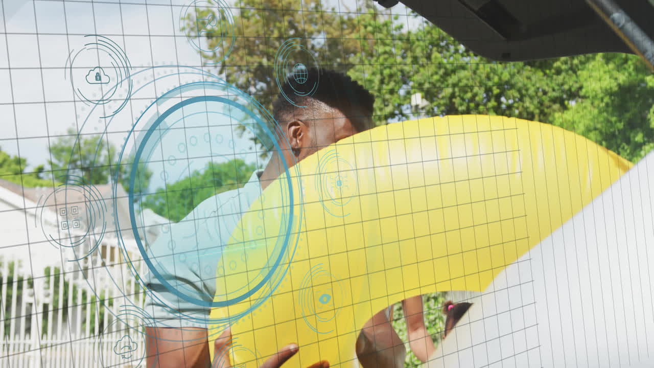 Carrying yellow inflatable ring, man interacting with digital animation outdoors