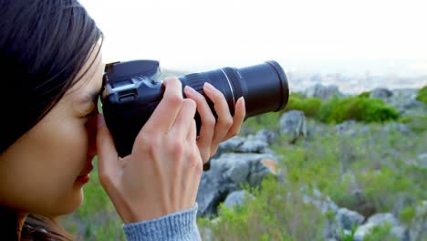 woman taking photo with digital camera 4k