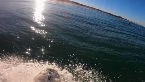 Close-up-shot-of-Handsome-guy-surfing-a-green-wave-in-guincho-surf-spot