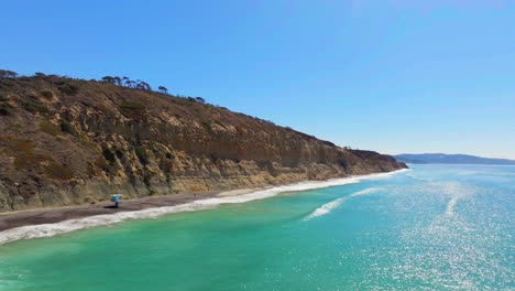 turquoise ocean and cliffs at torrey pines state beach in san diego, california, usa - aerial drone shot