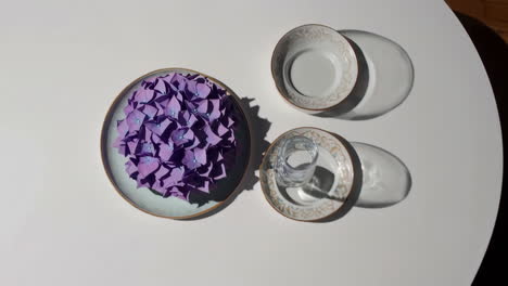 still life with purple hydrangeas and elegant tableware