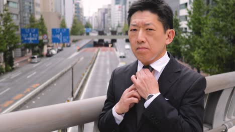 portrait of a japanese businessman in tokyo japan