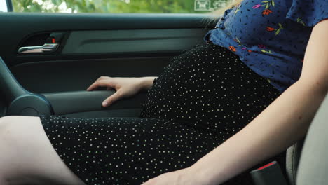 Unrecognizable-Pregnant-Woman-In-Passenger-Car-Seat-Belt