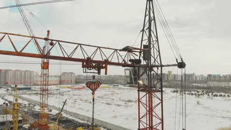 close-non-functioning-construction-crane-against-wasteland