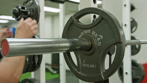 muscular man actively training in the modern gym