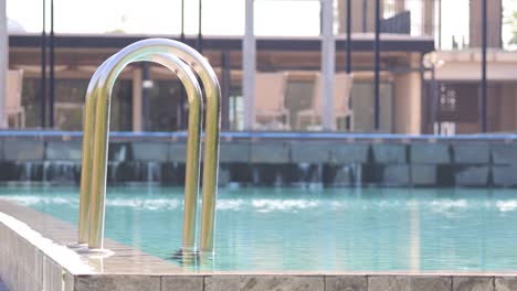 calm swimming pool with city backdrop