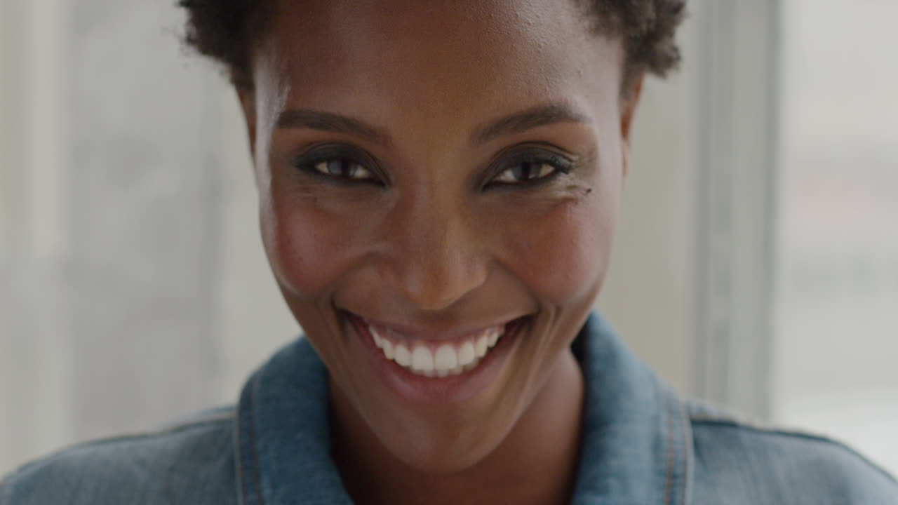 Portrait happy african american woman smiling at home
