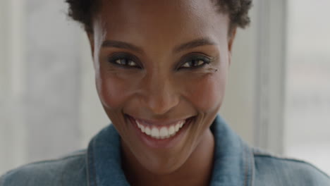 Portrait-happy-african-american-woman-smiling-at-home