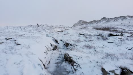 atoklimpen frozen bare mountain during harsh nordic winter in the north of sweden - low fly-over aerial shot