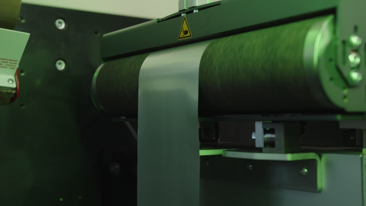 Aluminum foil on the roller feeder in the modern lid manufacturing facility