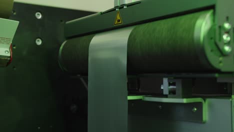 aluminum foil on the roller feeder in the modern lid manufacturing facility