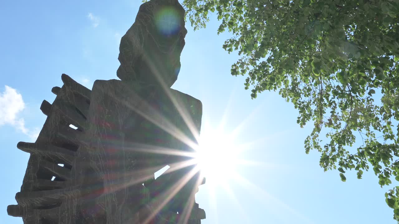 Mihai Eminescu sculpture in Chisinau, Moldova with the blue sky on the background