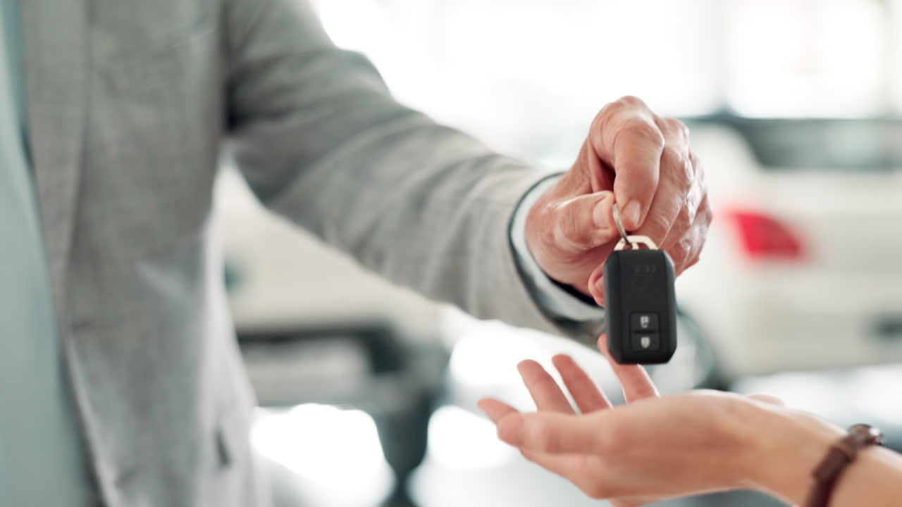 Handing over car keys in a dealership