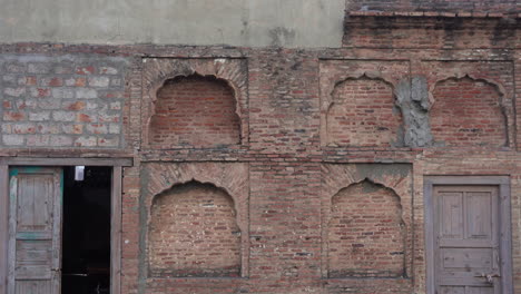 an old house wall in indian is made of red bricks