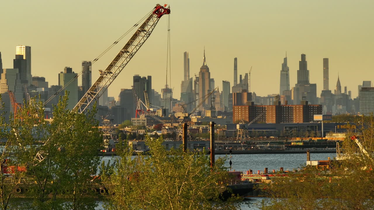 Aerial view of a construction site in New York City. Shot at sunset along The East River.