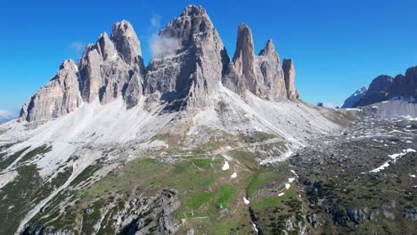 Aerial-flying-towards-Tre-Cime-di-Lavaredo-Southeast-side-on-sunny-day,-Italy