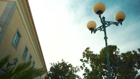 cloudy day with typical portuguese facade mansion with public lamp in camera truck shot 4k