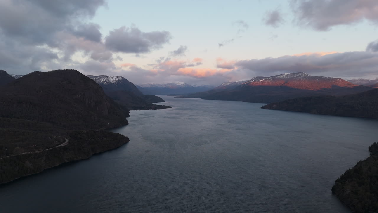 Stunning Aerial View of a Lake and Mountains at Sunset