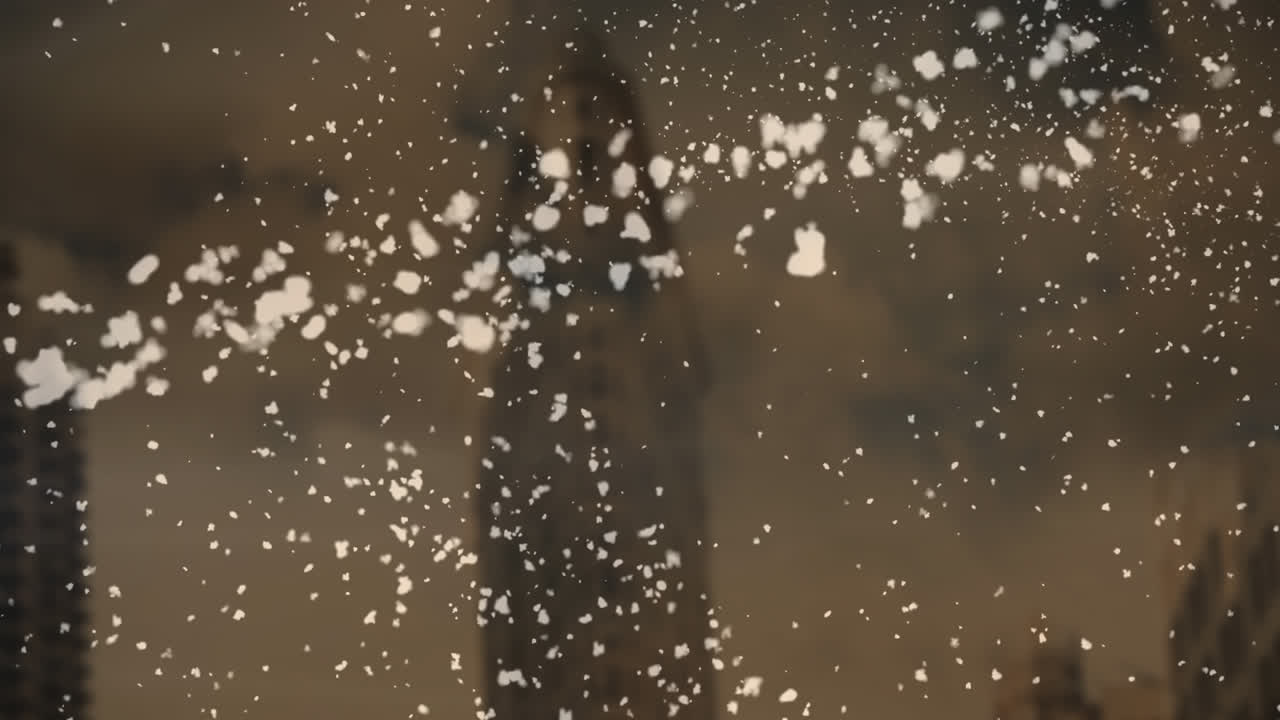 갈색 바탕에 도시 풍경 위에 떨어지는 별과 별의 애니메이션