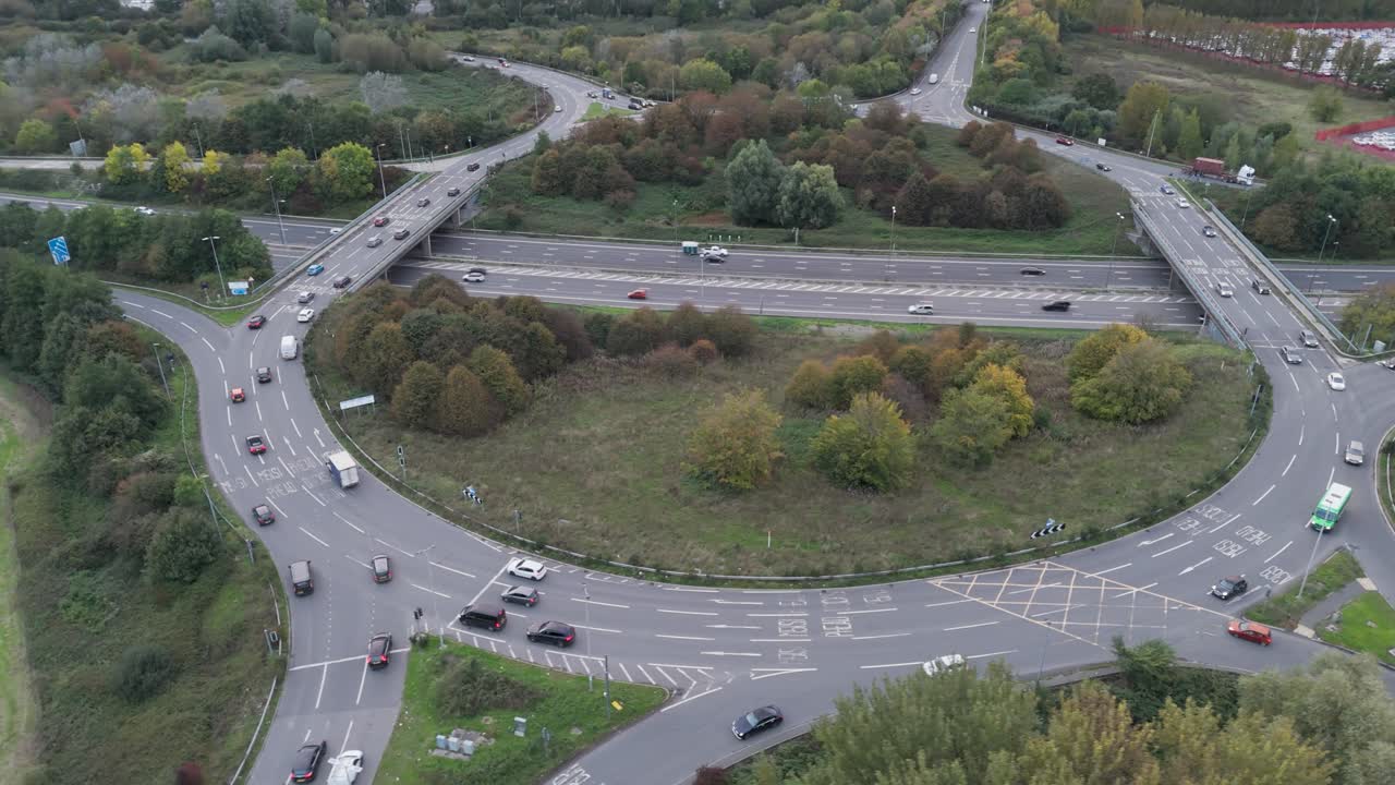 Aerial orbital view of traffic around the Gordano Interchange near Royal Portbury Dock, showcasing road infrastructure, Bristol, UK, October 2024