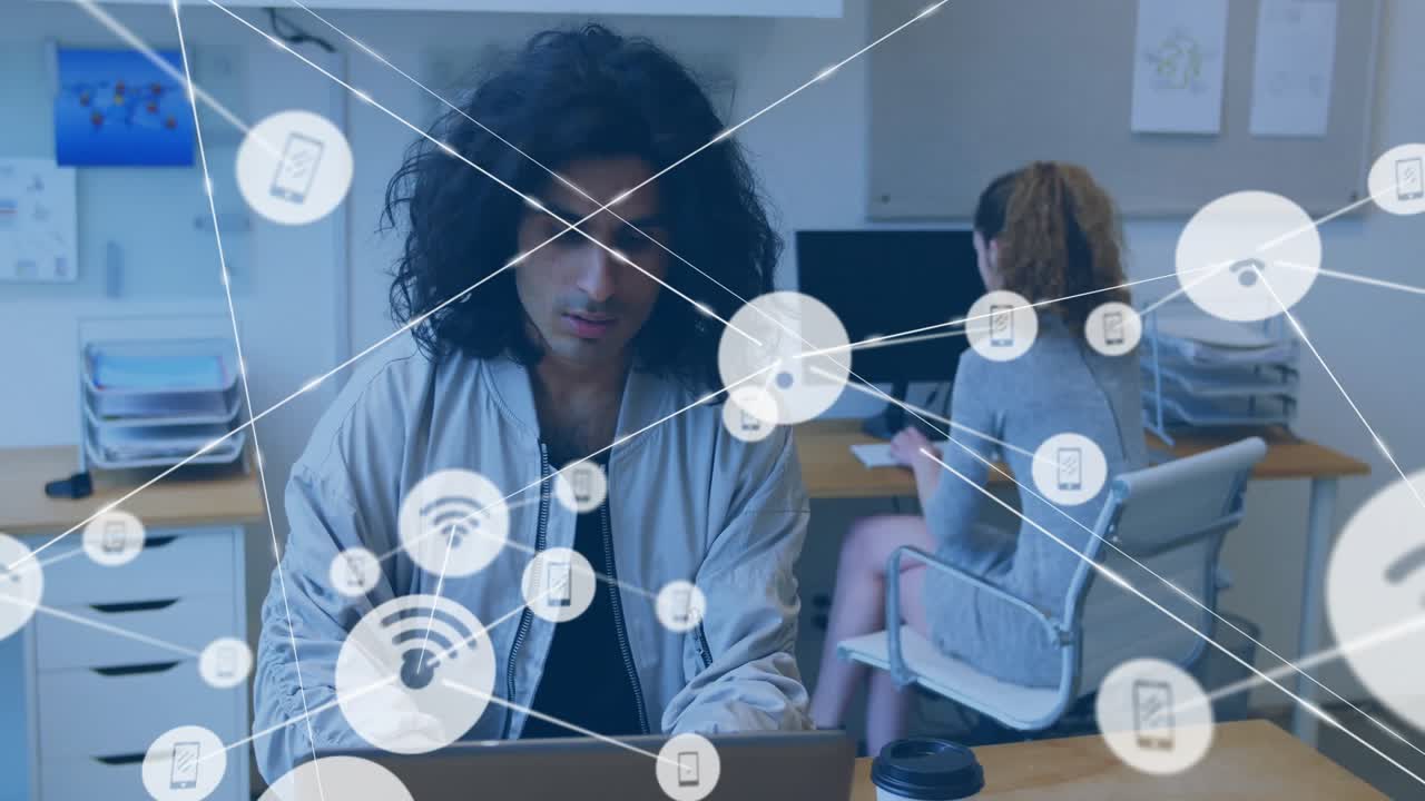 Male office worker and female colleague collaborating in office, showing floating Wi-Fi phone icons