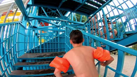 boy having fun in aqua park
