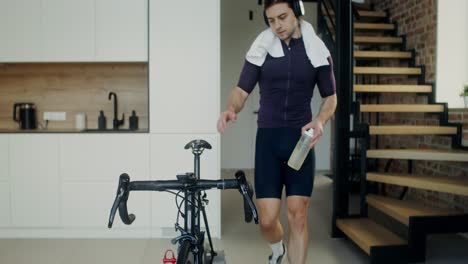 man indoor cycling workout at home