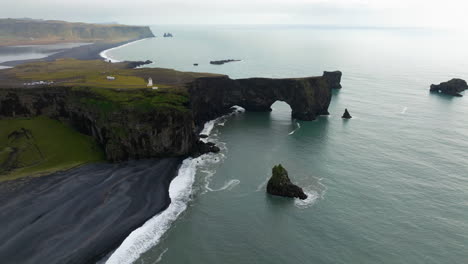 dyrholaey peninsula with cliffside lighthouse in vik, southern iceland