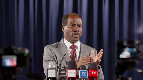 african american politician speaking to tv journalists