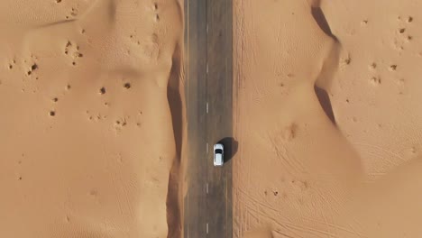 aerial view of car on desert road