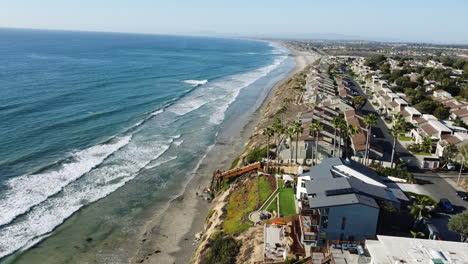 aerial shot - shoreline with beachfront houses